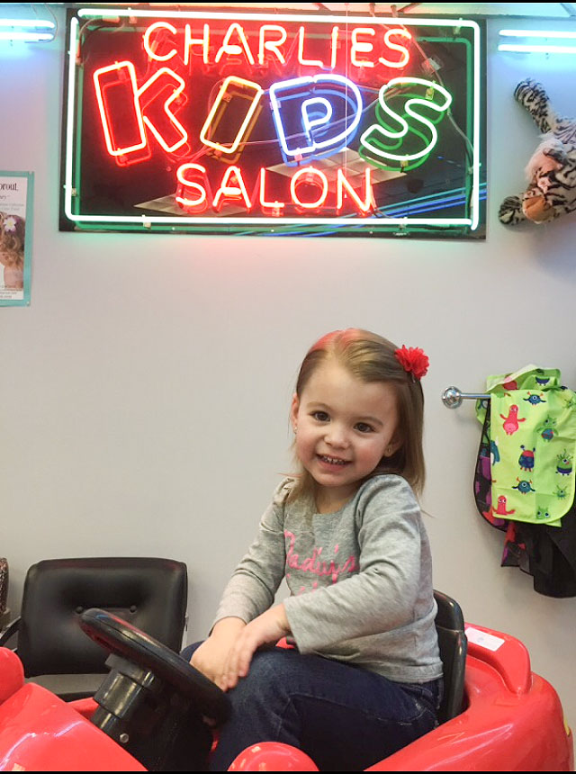 charlies kids salon girl in car image